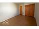 A room with a closet, doorway and parquet floor at 5868 Hillside Ave, Indianapolis, IN 46220