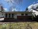 Charming single-story home with a brick facade and well-maintained landscaping at 5868 Hillside Ave, Indianapolis, IN 46220