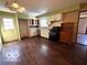 Open concept kitchen featuring white cabinets and dark appliances at 5868 Hillside Ave, Indianapolis, IN 46220