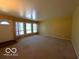 Living room with carpet and large windows at 5868 Hillside Ave, Indianapolis, IN 46220