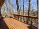 An expansive wood deck providing ample space for outdoor seating and relaxation, surrounded by woods at 61 Osage Ct, Columbus, IN 47201