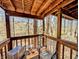 Cozy wooden deck area with a view of the surrounding trees, perfect for relaxing outdoors at 61 Osage Ct, Columbus, IN 47201