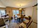 Cozy dining room featuring rustic wood furniture, slider to deck, and carpeted floors at 61 Osage Ct, Columbus, IN 47201