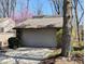 View of a two car attached garage with brick facade and new gray garage door at 61 Osage Ct, Columbus, IN 47201