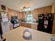 Functional kitchen featuring light wood cabinets and a large island for food preparation at 61 Osage Ct, Columbus, IN 47201