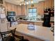 Functional kitchen featuring light wood cabinets and a large island for food preparation at 61 Osage Ct, Columbus, IN 47201