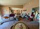Open-concept living and dining area with neutral tones, furniture, and natural light at 61 Osage Ct, Columbus, IN 47201