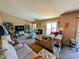 Spacious living room with a fireplace, plush sofas, and slider to exterior at 61 Osage Ct, Columbus, IN 47201