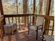 Wooden deck overlooking a wooded area, complemented by patio furniture and natural light at 61 Osage Ct, Columbus, IN 47201