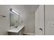 Modern bathroom with a vanity, mirror, and lighting fixtures, offering a clean aesthetic at 6508 Pergola Ln, Indianapolis, IN 46241
