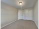 Comfortable bedroom features neutral walls, carpet flooring, and a closet with double doors at 6508 Pergola Ln, Indianapolis, IN 46241