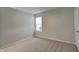 Cozy bedroom featuring neutral walls, carpet flooring, and natural light from the window at 6508 Pergola Ln, Indianapolis, IN 46241