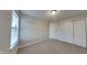 Bright bedroom featuring neutral walls, carpet flooring, and natural light from the window at 6508 Pergola Ln, Indianapolis, IN 46241