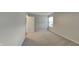 Inviting bedroom with neutral walls, carpet flooring, and a large window for ample sunlight at 6508 Pergola Ln, Indianapolis, IN 46241