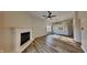 Bright living room featuring a cozy fireplace, hardwood floors, and a spacious open layout perfect for entertaining at 6508 Pergola Ln, Indianapolis, IN 46241