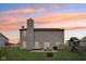 Enjoy sunsets in your backyard featuring a patio, outdoor furniture, a fire pit, and a playset for the  at 6526 Angel Falls Dr, Noblesville, IN 46062