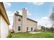The backyard features a patio, lawn, playground, and string lights, perfect for outdoor entertaining and play at 6526 Angel Falls Dr, Noblesville, IN 46062