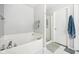 Clean bathroom featuring a soaking tub, a glass door shower, and neutral gray walls for a modern aesthetic at 6526 Angel Falls Dr, Noblesville, IN 46062