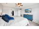 Spacious bedroom features a ceiling fan, blue dresser, and television for a relaxing and entertaining atmosphere at 6526 Angel Falls Dr, Noblesville, IN 46062