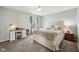 Cozy bedroom with upholstered bed frame, desk and plush carpet at 6526 Angel Falls Dr, Noblesville, IN 46062
