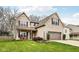 Well-maintained home with a two-car garage, complemented by lush landscaping at 6526 Angel Falls Dr, Noblesville, IN 46062