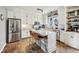 Modern kitchen featuring stainless steel appliances, white cabinets, granite countertops, and a tiled floor at 6526 Angel Falls Dr, Noblesville, IN 46062