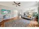 Open-concept living room featuring hardwood floors and modern decor with natural light at 6526 Angel Falls Dr, Noblesville, IN 46062