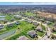 Aerial view showcases a neighborhood with well-manicured lawns, ponds, and new construction at 6674 Buhrstone Ln, Avon, IN 46123