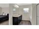 Beautiful bathroom with double sink vanity and soaking tub, with the main bedroom in the background at 6674 Buhrstone Ln, Avon, IN 46123