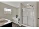 Bright bathroom features a large soaking tub, glass-enclosed shower, and a double sink vanity at 6674 Buhrstone Ln, Avon, IN 46123