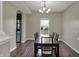 Dining room featuring a dark wood table with seating for six and modern chandelier lighting at 6674 Buhrstone Ln, Avon, IN 46123