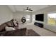 Comfortable living room with a large sectional couch, ceiling fan, and view of the yard at 6674 Buhrstone Ln, Avon, IN 46123