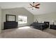 Spacious main bedroom features a vaulted ceiling, ceiling fan, and an abundance of natural light at 6674 Buhrstone Ln, Avon, IN 46123