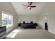 This spacious main bedroom offers plenty of natural light from the large window and neutral carpeting at 6674 Buhrstone Ln, Avon, IN 46123