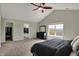 Bright main bedroom with vaulted ceiling, closet access, and a view from the large window at 6674 Buhrstone Ln, Avon, IN 46123