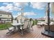 Outdoor deck with seating, dining furniture, and views of the backyard and surrounding homes at 6707 Meadow View Ct, Avon, IN 46123