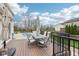 Inviting backyard deck features stylish outdoor dining set and umbrella, overlooking a sparkling pool at 6707 Meadow View Ct, Avon, IN 46123