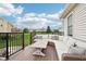 Relaxing backyard deck featuring comfortable seating and a view of the manicured lawn at 6707 Meadow View Ct, Avon, IN 46123