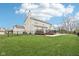 Expansive backyard features a large deck, fenced perimeter, and lush green lawn, perfect for outdoor enjoyment at 6707 Meadow View Ct, Avon, IN 46123