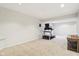 Large finished basement with neutral carpeting, recessed lighting, and room for activities at 6707 Meadow View Ct, Avon, IN 46123