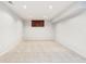Finished basement with neutral carpet, bright lighting, and a small window at 6707 Meadow View Ct, Avon, IN 46123