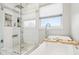 Well-appointed bathroom with a soaking tub and glass-enclosed shower for a spa-like experience at 6707 Meadow View Ct, Avon, IN 46123