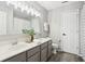 Bright bathroom featuring a double vanity, modern lighting, and neutral color scheme at 6707 Meadow View Ct, Avon, IN 46123