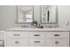 Elegant bathroom featuring dual sinks with marble countertop and framed mirrors at 6707 Meadow View Ct, Avon, IN 46123