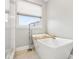 Bright bathroom featuring freestanding tub and modern fixtures, offering a relaxing retreat at 6707 Meadow View Ct, Avon, IN 46123