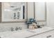 Close-up of bathroom featuring dual sinks with marble countertop and framed mirrors at 6707 Meadow View Ct, Avon, IN 46123