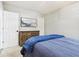 Bedroom featuring carpeted floors, a wooden dresser, and a cozy blue blanket at 6707 Meadow View Ct, Avon, IN 46123