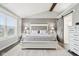Comfortable bedroom featuring a queen bed, an area rug, and a sliding barn door at 6707 Meadow View Ct, Avon, IN 46123