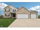 Beautiful exterior of a brick and siding home featuring a three-car garage at 6707 Meadow View Ct, Avon, IN 46123