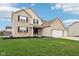 Well-maintained home with a lush green lawn and beautiful curb appeal at 6707 Meadow View Ct, Avon, IN 46123